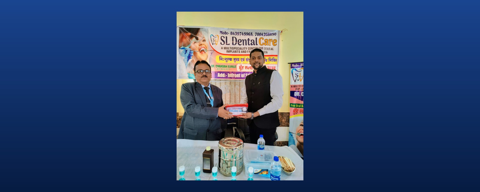 Handing over dental care kits at a free camp inauguration